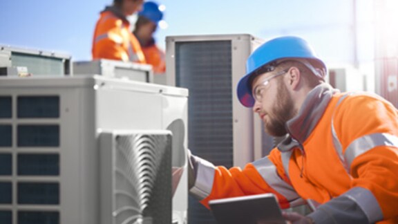 A worker fixing the ventilation machine